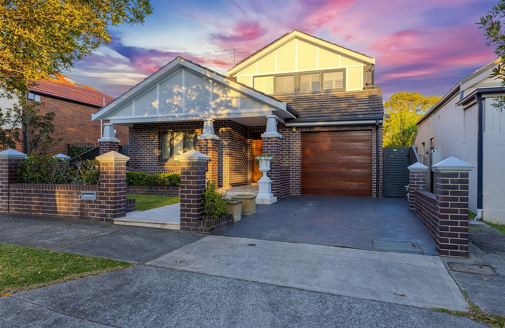 Modern house with brick facade and wooden garage door