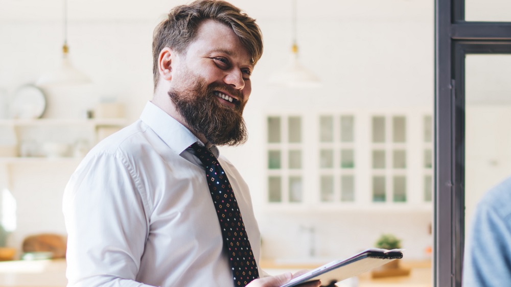 Property buyers agent reviewing documents and negotiating property purchases on behalf of clients.