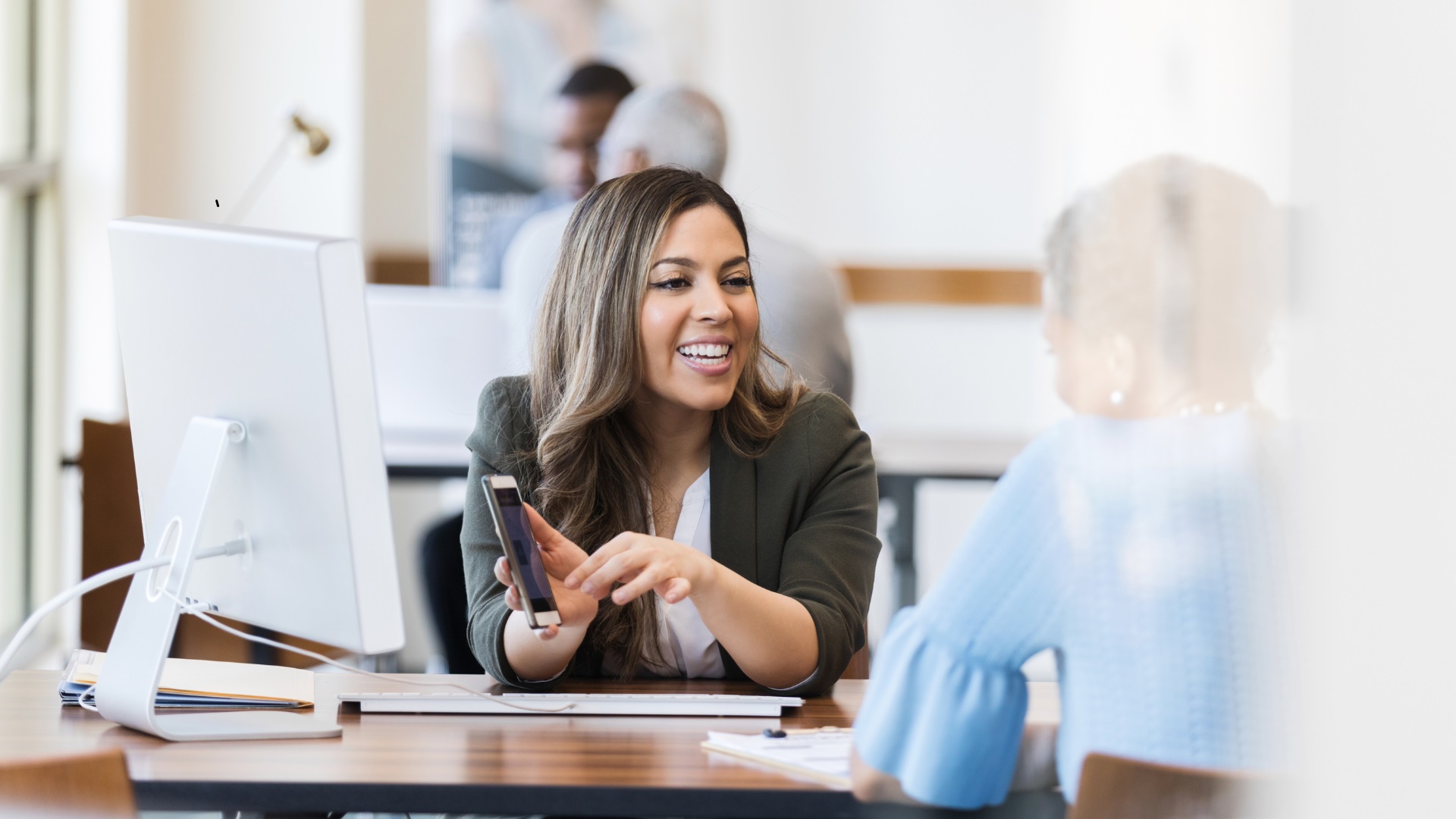 Mortgage broker explaining offset account and redraw facility options to a home loan client.