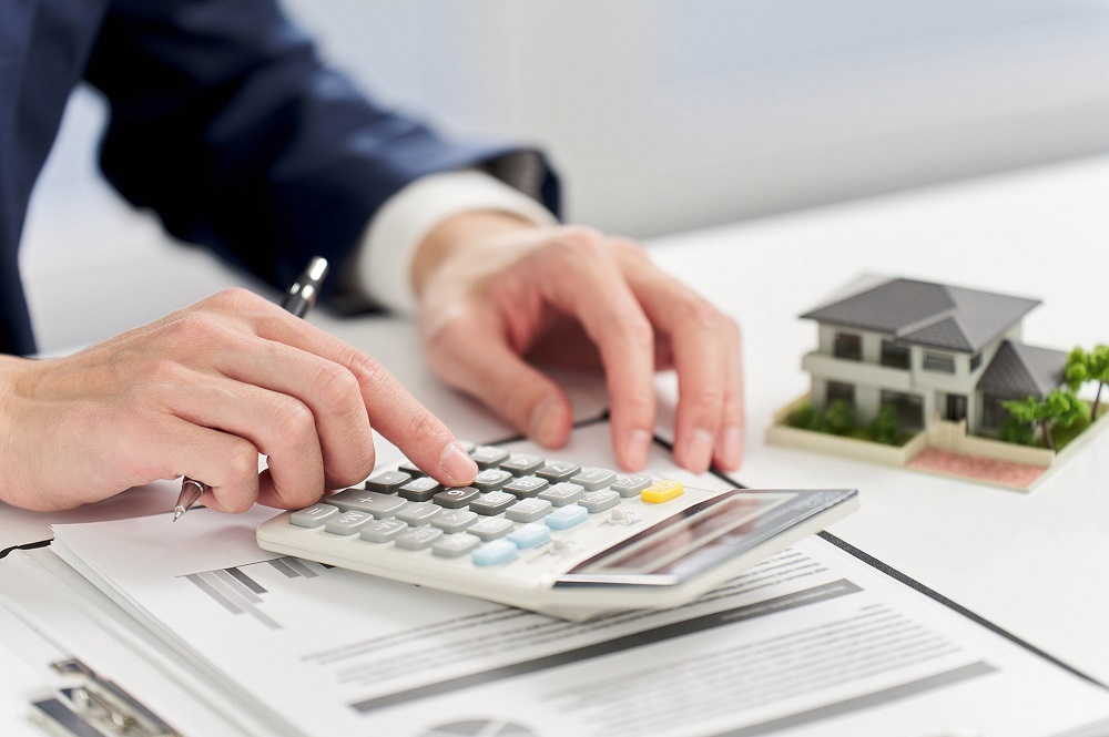Calculating finances for buying investment property through a trust in Australia.