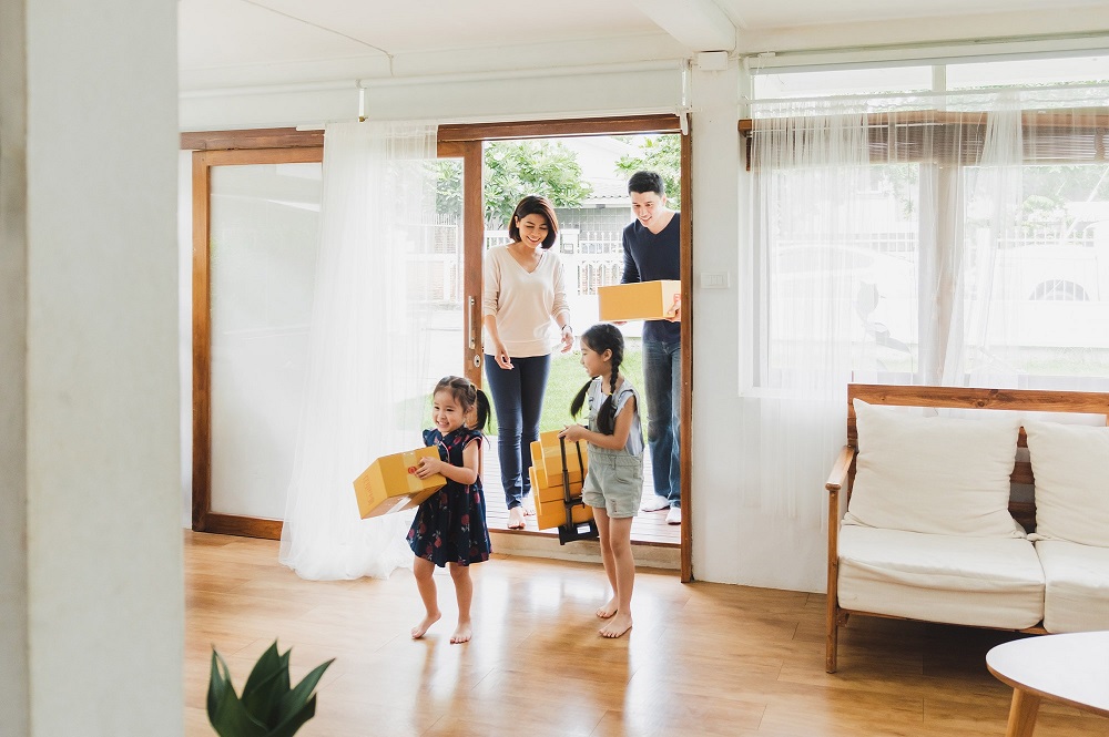 Family moving into their new home after obtaining a self-employed mortgage in Australia.